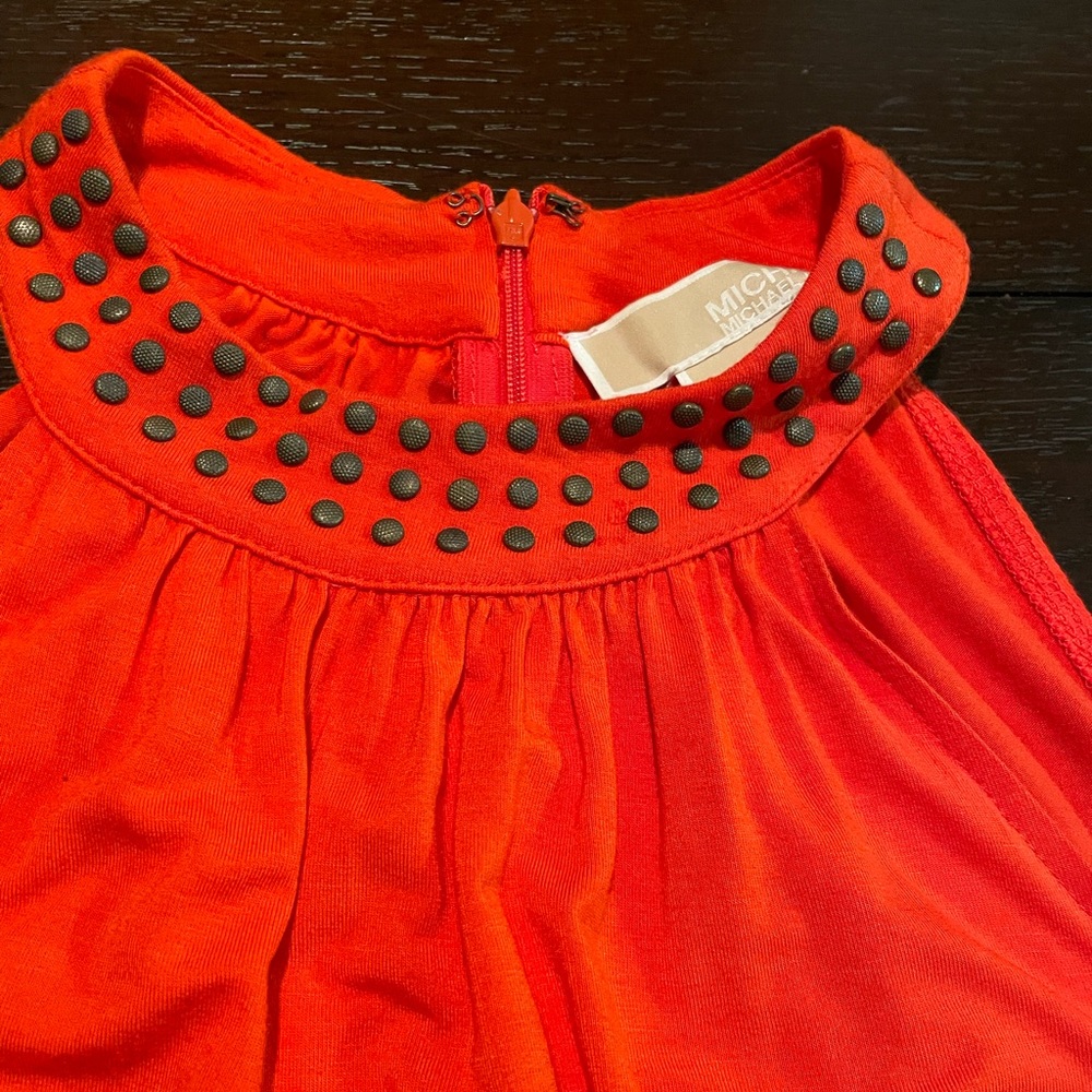 Orange is the new black with this studded tank top by Michael Kors